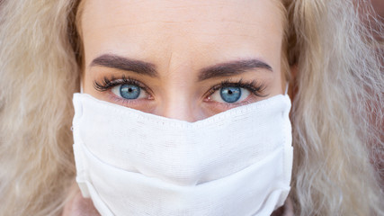 Portrait of a girl in a protective medical mask on the street. Virus epidemic in the world