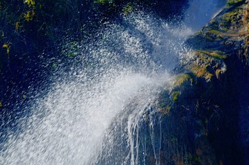 Mountain waterfall with splashes of water.