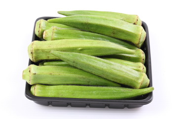 Fresh raw okra isolated on white background