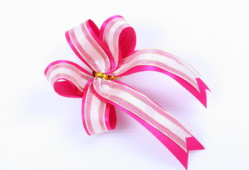 Red and white ribbon bow on white background