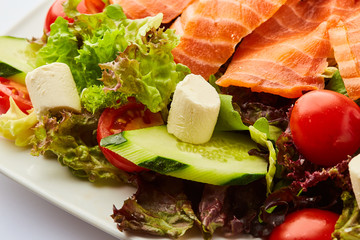 Healthy vegetable salad with smoked salmon. Buddha bowl, dieting concept