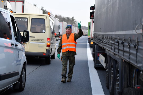 Soldiers of the German armed forces Bundeswehr deliver food supply for truck drivers trapped in a traffic jam on the highway A 4 near Goerlitz
