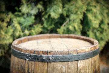 Old wooden barrel in garden and free space for your decoration. 