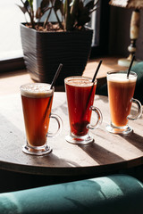 Hot fruit drinks in cafe, three types.