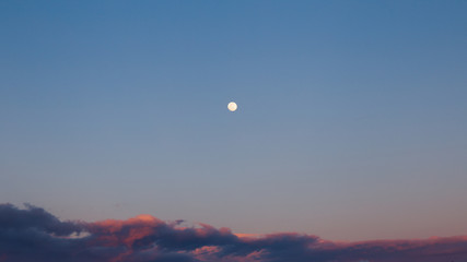 sunset in the sky, full moon and clouds