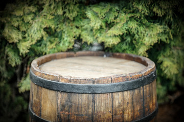 Old wooden barrel in garden and free space for your decoration. 