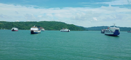 Passenger boat and passenger car across the sea.