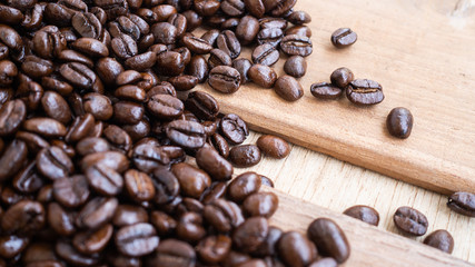 dark rose coffee bean, Black coffee cup on old wooden table top view.