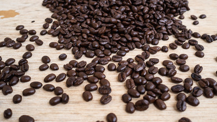 dark rose coffee bean, Black coffee cup on old wooden table top view.