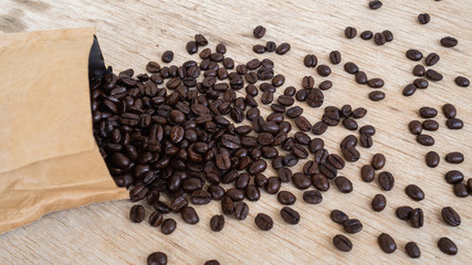 dark rose coffee bean, Black coffee cup on old wooden table top view.