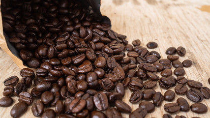 dark rose coffee bean, Black coffee cup on old wooden table top view.