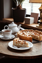 Table in a cafe, tea with apple pie.