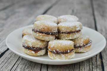 Traditional serbian vanilla cookies with jam, vanilice, on the plate, close up