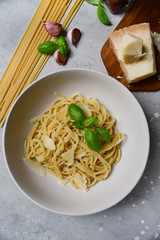 Restaurant food delivery lunch at home. spaghetti with Parmesan cheese and herbs. food delivery to quarantine COVID-19. recipe homemade pasta. classic Italian cuisine. selective focus