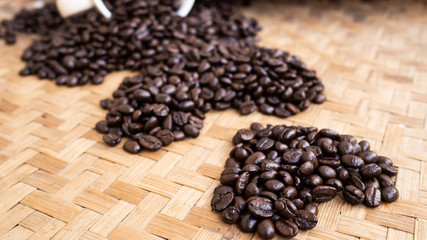 dark rose coffee bean, Black coffee cup on old wooden table top view.