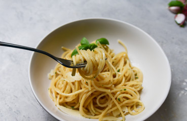 Restaurant food delivery lunch at home. spaghetti with Parmesan cheese and herbs. food delivery to quarantine COVID-19. recipe homemade pasta. classic Italian cuisine. selective focus