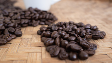 dark rose coffee bean, Black coffee cup on old wooden table top view.