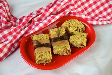 Matcha green tea breakfast bars made from oat, matcha powder, maple syrup, goji berry, pumpkin seed, sunflower seed, date, brazil nuts and sesame seeds. 