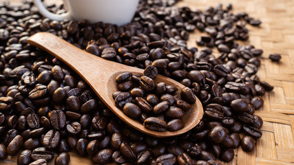 dark rose coffee bean, Black coffee cup on old wooden table top view.