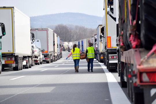 Volunteers deliver food supply for truck drivers trapped in a traffic jam on the highway A 4 during the spread of the coronavirus disease (COVID-19) near Goerlitz