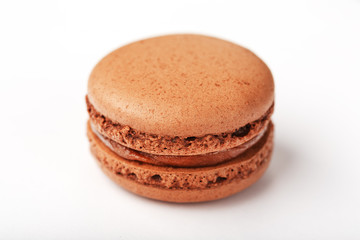 Chocolate macaroni cookies on a white background with brown filling, isolated.