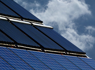 roof installed photovoltaic solar panel and water heater pipe combination system sloped clay roof...