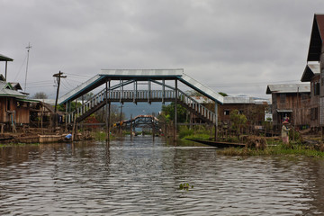 A village and a wooden footbridge on the Inle Lake, Myanmar