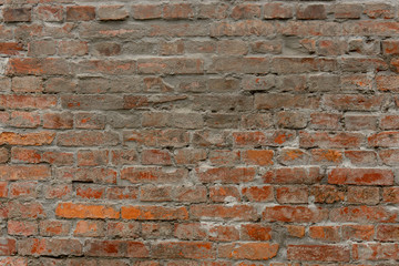 Fototapeta premium Old wall of natural brown color clay brick in background
