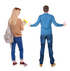 Back view of couple in sweater showing thumbs up.