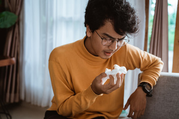 Man blood coughing wipe it with tissue at home
