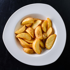 rustic potatoes in a white plate