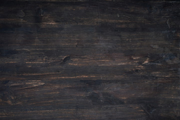 Naklejka premium Dark wooden plank background. Vintage and retro style.