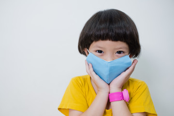  kid wearing mask on white background, protect virus covid-19