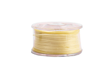 A spool of thread from a sewing machine on a white background isolated