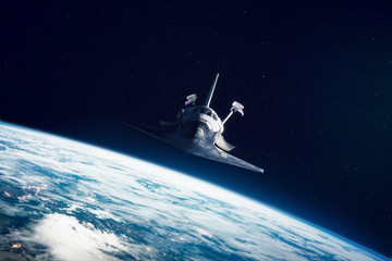 Space Shuttle with astronauts EVA
