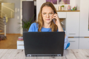 a woman in the home office - sunny day