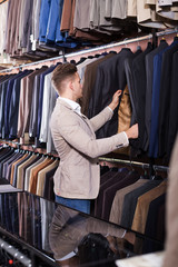 Man choosing new suit