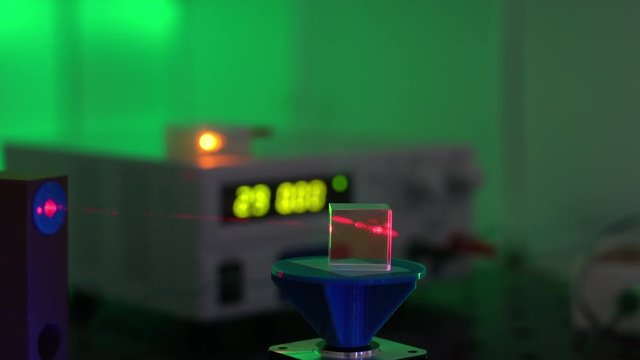  laser in a quantum optics lab. Semiconductor laser on optical table in a quantum physics optics lab.