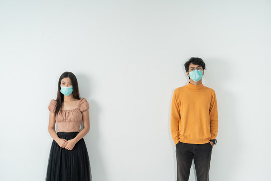 social distancing. people with masks keep their distance during virus symptoms