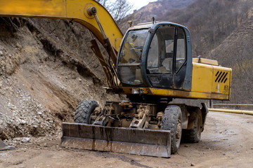 Excavator in the mountains for industrial work