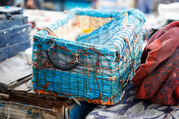 Traditional blue fish container for fish, fishing port Essaouira, Morocco 