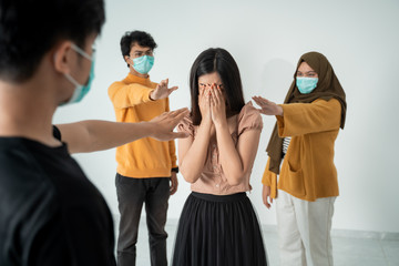people with masks trying to touch healthy woman concept. virus epidemic