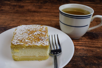 lemon square wityh a cup of tea