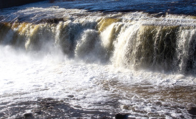 Waterfall on the river Narva. Variegated wide waterfall