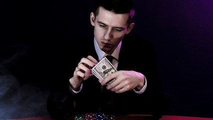 man is sitting at the poker table. poker game.