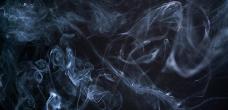 Medical smoke from marijuana. A drug. Isolated white mist on a black background. Copyspace for your text