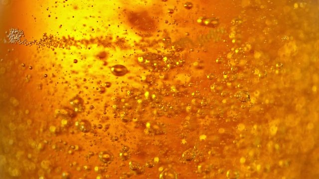 Super Slow Motion Detail Shot of Beer Bubbles in Glass at 1000fps.