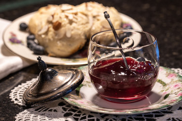 Jam and fresh scones on floral china