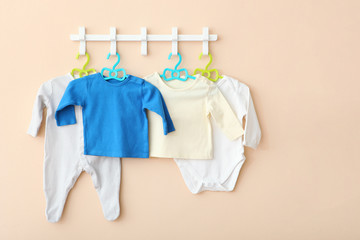 Baby clothes on a hanger. Place for text, minimalism.