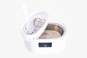 Cleaning systems for medical instruments. Ultrasonic cleaner on white background